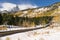 Scenic paved road after the first Fall snow storm in Rocky Mountain National Park, Colorado.