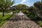 Scenic pebbled pathway leading to the medieval garden of Borromeo Castle, Lombardy, Italy