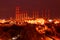 Scenic of petrochemical oil refinery plant shines at night.