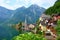 Scenic picture postcard view of famous Hallstatt mountain village in the Austrian Alps at beautiful light in summer, Salzkammergut