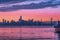 Scenic purple sunset with Oakland Bay Bridge in San Francisco with skyscrapers in the background