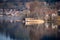 Scenic reflection of a boathouse on an island in lake Schliersee