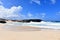 Scenic Remote Beach with Waves Rolling Ashore in Aruba