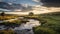 Scenic River Flowing Through Green Field: A Captivating Landscape By Mitch Griffiths