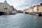 Scenic river view of vibrant buildings and boats in Copenhagen, Denmark.