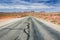 Scenic road through desert landscape leading towards Monument Valley