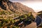 Scenic road in mountain landscape with sunset. Road trip. Beautiful nature and a small mountain village. Valle Gran Rey, La Gomera