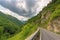 scenic road trip on a mountain highway, with breathtaking views of the mountains and forests