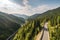 scenic road trip on a mountain highway, with breathtaking views of the mountains and forests