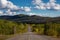 Scenic Road View of Klondike Hwy during a sunny and cloudy day.