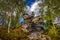 Scenic rock formation in autumn birch forest near stone labyrinth Bledne skaly in Szczeliniec Wielki