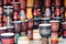 Scenic rows of colorful wooden djembe drums at souvenir shop