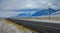 Scenic rural freeway leads a truck across the breathtaking Montana prairie.