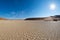 Scenic sand dunes and cracked clay pan in Sossusvlei, Namib Naukluft National Park, best tourist and travel attraction in