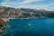 Scenic sea mountains and blue water with sailing boats in Porto Kagio, Mani, Greece