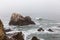 Scenic shot of beautiful stormy ocean with rock formations in Big Sur, California