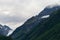 Scenic shot of Chugach Mountain in Valdez, Alaska under a cloudy sky
