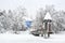 A scenic shot of human-size Moominhouse in the heavy snowfall