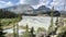 Scenic shot of a lake on the foot of rocky hills in the Great Divide Trail, Canada