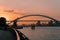 Scenic shot of the Lupu bridge and the cityscape of Shanghai during the evening with a golden sunset