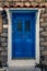 Scenic shot of a picturesque door entrance into a stone house p