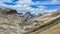 Scenic shot of a river flowing through rocky hills in the Great Divide Trail, Canada