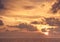 Scenic sky sunset with sun sea horizon with clouds orange background