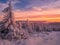 Scenic snowy landscape with a view from a mounatin range to the valley