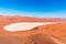 The scenic Sossusvlei and Deadvlei, clay and salt pan surrounded by majestic sand dunes. Namib Naukluft National Park, travel dest