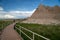 Scenic, South Dakota - June 21, 2020: Tourists hike along the boardwalk trail of the Notch and Window trail in Badlands National