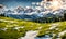 Scenic spring: Meadow with snowy mountains in background