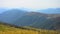 Scenic summer landscape in mountains with meadow grass