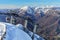 Scenic sunny landscape of gondola cable way ski lift of Gorky Gorod mountain ski resort in Sochi at winter with snowy Caucasus mou