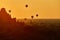 Scenic sunrise with many hot air balloons above Bagan in Myanmar