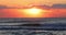 Scenic sunrise or sunset over ocean waves. 4k slow motion video