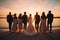 Scenic Sunset: Bridal Party on a Tranquil Beach