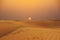 Scenic sunset over Arabian Desert with sand dunes, wilderness desert landscape or panorama