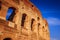 Scenic sunset over the Colosseum. Marble arches ruins over a blue sky, Rome, Italy