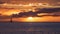 Scenic sunset with a sail boat viewed from Lahaina harbor, Maui, Hawaii.