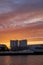 Scenic sunset sky behind the filling stations of the mineral grinding plant in Brake Unterweser, Germany