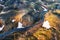 Scenic surreal volcanic mountain with river through lava field located remote in Highlands of Iceland