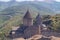 Scenic Tatev monastery view in Armenia. Ancient church ruins. Armenian landscape of Tatev monastery complex surrounded by green