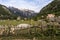 Scenic Theth mountain village panorama with an old wooden picket fence and an ancient church, northern Shkodra region, Albania