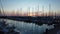 Scenic time lapse sunset at marina in Ostia Lido of Rome with many sailboats