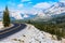 Scenic Tioga Pass road running through Sierra Nevada mountain scenery on sunny day in summer near Olmsted Point in Yosemite