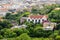 Scenic top view on Budapest from Gellert Hill. Ancient houses with tiled roofs on background of