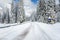 Scenic Twisty Road Covered in Snow in the European Alps