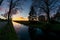 Scenic ultra wide angle view of a sunset over the dutch countryside