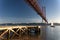 Scenic view of the 25 of April Bridge Ponte 25 de Abril over the Tagus River with sailing boats, in the city of Lisbon