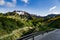 Scenic view on abandoned buddhist temple, mountains and road to mountain Aso